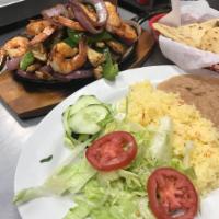 Trio Fajitas Special · Steak, chicken and shrimp fajitas all in 1 large plate. Served with a side order of handmade...