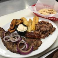 Churrasco · Steak with casamiento (rice), chorizo, fried banana and yucca. Comes with a side order of ha...