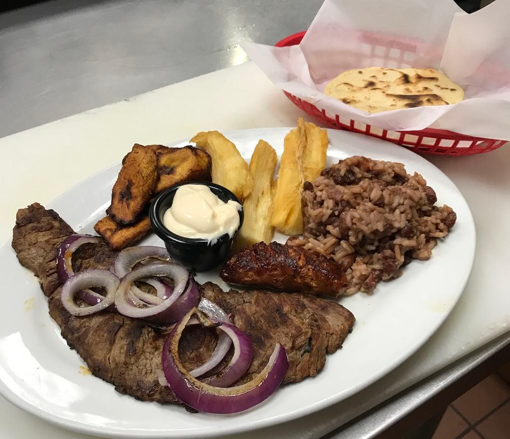 Churrasco · Steak with casamiento (rice), chorizo, fried banana and yucca. Comes with a side order of handmade Tortillas 
