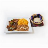 Carne Adobada · Pork loin dish in a traditional marinade served with rice, beans and tortillas.