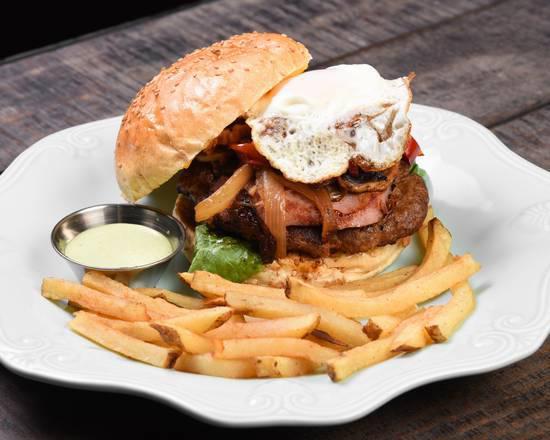 D'Antigua Burger Combo · ITS INDULGENT AND JUICY,   BACON CHEESEBURGER TOPPED WITH A FRIED EGG, LOADED WITH HAM, MUSHROOMS, LETTUCES, TOMATOES, ONIONS AND PEPPERS, AND OUR SPECIAL SAUCES. Come with house french fries