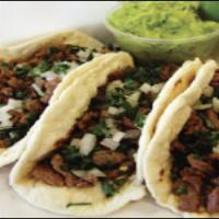 Carne Tacos (BEEF TACOS) 3 PC · FLAVORFUL STEAK STRIPS SERVED OVER SOFT FLOUR TORTILLA SHELLS, CHOPPED ONIONS,AND CILANTRO L...