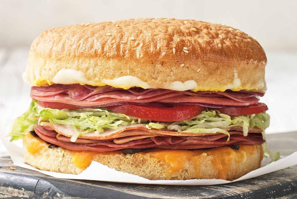 Deluxe Original · Like The Original®, but with more than double the meat. Ham, salami, 3 cheeses, olives, lettuce, onion, tomato, mustard, signature sauce, sourdough bun. 