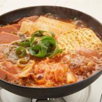 Budae Jjigae 부대찌개 · Army stew. Spicy sausage stew with spam, tofu & vegetables.