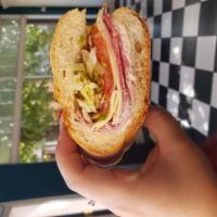 Provolone Amore · Salami, capicola, ham, shaved lettuce, tomatoes, hot peppers, red onion, provolone, oil and ...