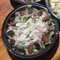 Goat Cheese · Spring mix, figs, goat cheese, red onion, housemade creamy pistachio pesto dressing.