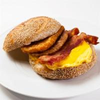 The Works Sandwich · Eggs with hash browns, sausage, American cheese, and bacon.