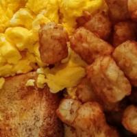 Breakfast Combo · 3 pieces of French toast, 3 pieces of scrambled eggs, and hash.
