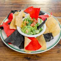 Chips and Guacamole · Thinly sliced crispy potato and a creamy dip made from avocado.