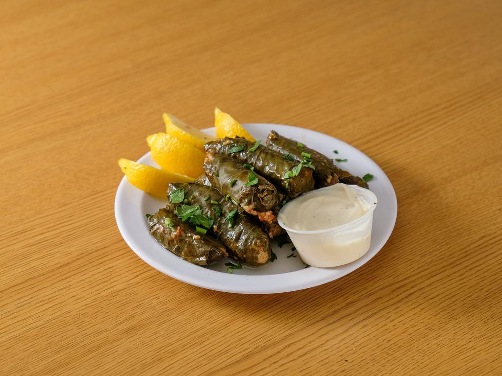 Homemade Grape Leaves · 6 pieces. stuffed with herb rice and comes with tzatziki sauce.