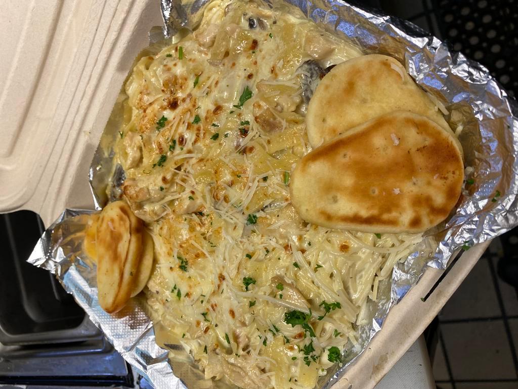 Alfredo Chicken Pasta · Angel hair pasta with chicken mushroom home Alfredo sauce topped with mozzarella and Parmesan cheese.