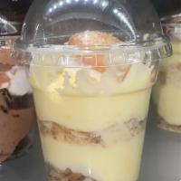 Banana Parfait · A rich and creamy banana pudding with sliced bananas and wafer crumble, topped with whipped ...