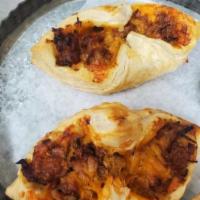 Pulled BBQ Pork Puff Lunch · Roasted pulled pork mixed with sweet BBQ sauce topped with cheddar cheese and baked in puff ...