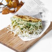 The Beauty Queen Arepa · Pulled chicken, avocado, cilantro mayo and mustard.