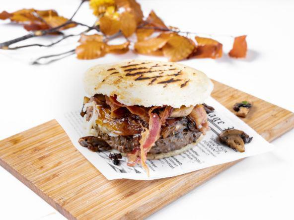 Arepa Burger · Buger pattie, bacon, mushrooms, caramelized onions and cheese.