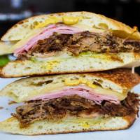 Cuban Sandwich · SLOW ROASTED PULLED PORK, HAM, SWISS CHEESE, PICKLES, MUSTARD