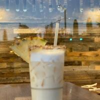 THE PAINKILLER · Shaken to look like a twisted Pina Colada made with Orange, and Pinapple juices, Cream of co...
