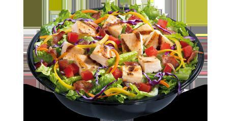 Crispy Chicken BLT Salad · Served with your choice of Marzetti® dressing and topped with crispy chicken, chopped tomatoes, crispy bacon crumbles, shredded cheddar cheese, red cabbage and shredded carrots