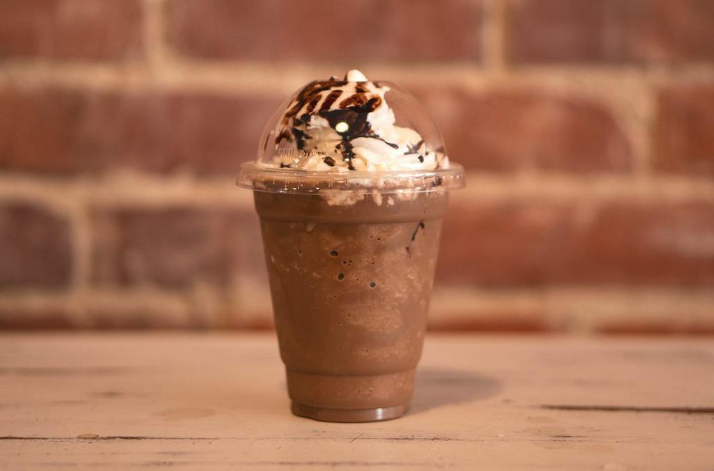 Mocha Frappe · Coffee base with mocha sauce, milk and ice blended and topped with whipped cream and chocolate sauce.