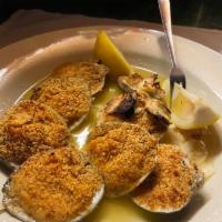 Clams Oreganata · 8 pieces. Baked clams in a half shell topped with breadcrumbs and oregano. 