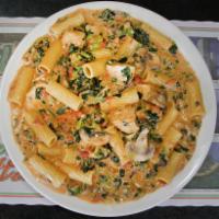 Rigatoni Messinase · Chunks of chicken, spinach and fresh mushrooms in a creamy marinara sauce.