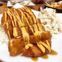 Chicken Katsu · Breaded chicken cutlet served over a
bed of steamed rice and coleslaw on
the side, drizzled ...