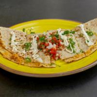 Cheese Quesadilla · Served with sour cream, fresh guacamole, and pico de gallo in a garlic flour tortilla.