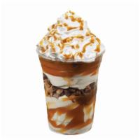 Heath® Sundae Dasher® · Layers of Heath® pieces, vanilla ice cream and caramel topped with whipped cream and caramel...