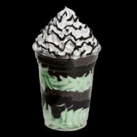Mint Chocolate Chip Sundae Dasher · Mint chocolate chip ice cream layered with hot fudge, chocolate crunchies and topped with wh...