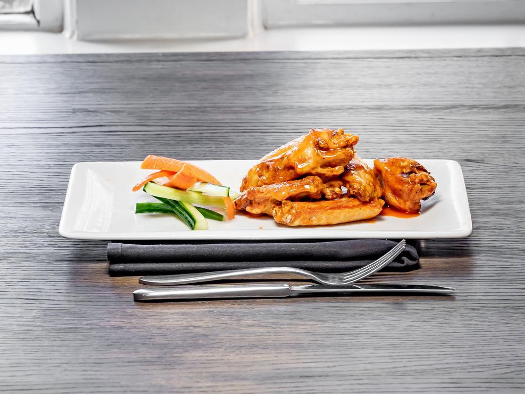 Crispy Chicken Wings · Buffalo, BBQ or dry rub. Served with carrots and cucumber slices and ranch.
