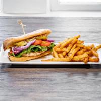 Canvas Chicken Sandwich · Grilled or fried chicken, lettuce, tomato, pickles, honey mustard and ciabatta. Served with ...