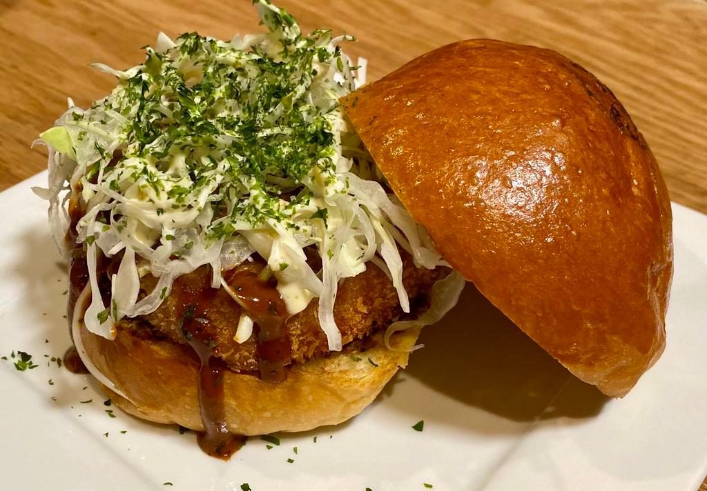 Katsu Burger · 5 oz of Japanese A5 Wagyu Tenderloin cutlet, yuzu seaweed cabbage slaw. Served with pickles and fries on the side.