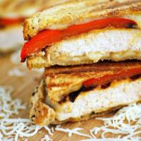Grilled Chicken Panini · Grilled chicken with fresh mozzarella, roasted peppers and balsamic vinegar.