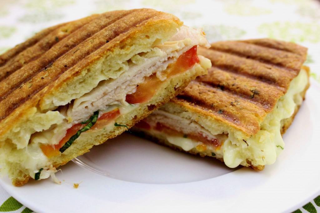 Chicken Cutlet Panini  · Breaded chicken cutlet with American cheese, lettuce, tomato and ranch dressing.