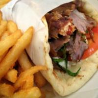 Beef Gyro Combo · Lettuce, tomato, onion and tzatziki sauce on pita with a side of French Fries
