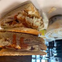 The Monte Christo Sandwich · Sliced turkey, bacon, melted Swiss cheese, coleslaw and Russian dressing.