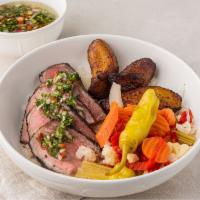 Chimichurri lamb bowl · New Zealand leg of lamb with chimichurri sauce served over rice, vinaigrette veggies and fri...