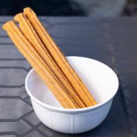 Churros · 2 Fried dough sticks topped with cinnamon and sugar