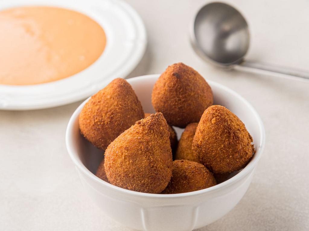 Coxinhas (Chicken Croquettes) · The most popular appetizer in Brazil made with potatoes, flour and filled with chicken (8 pieces).