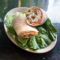 Turkey Club Wrap · Turkey breast, American cheese, bacon, lettuce, tomatoes, and a touch of mayo in a soft wrap.