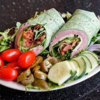 Ham Swiss Club Wrap · Freshly sliced ham and Swiss cheese topped with fresh tomato, green salad, crumbled bacon, a...