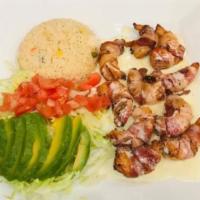 Camarones Momia · Bacon wrapped shrimp topped with cheese dip. Served with white rice, lettuce, tomato, and av...