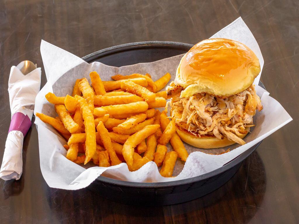 Pulled Chicken Sandwich Combo · Seasoned, smoked and shredded chicken breasts and thighs on a potato roll with your choice of a side, drink and a sauce on the side.