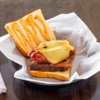 The Hoss Sandwich Combo · Smoked brisket and beef sausage topped with gouda cheese then covered in our special 