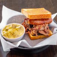 Pitmaster Deluxe Sandwich Combo · Our largest sandwich stacked high with smoked brisket, pulled pork and jalapeno cheddar saus...