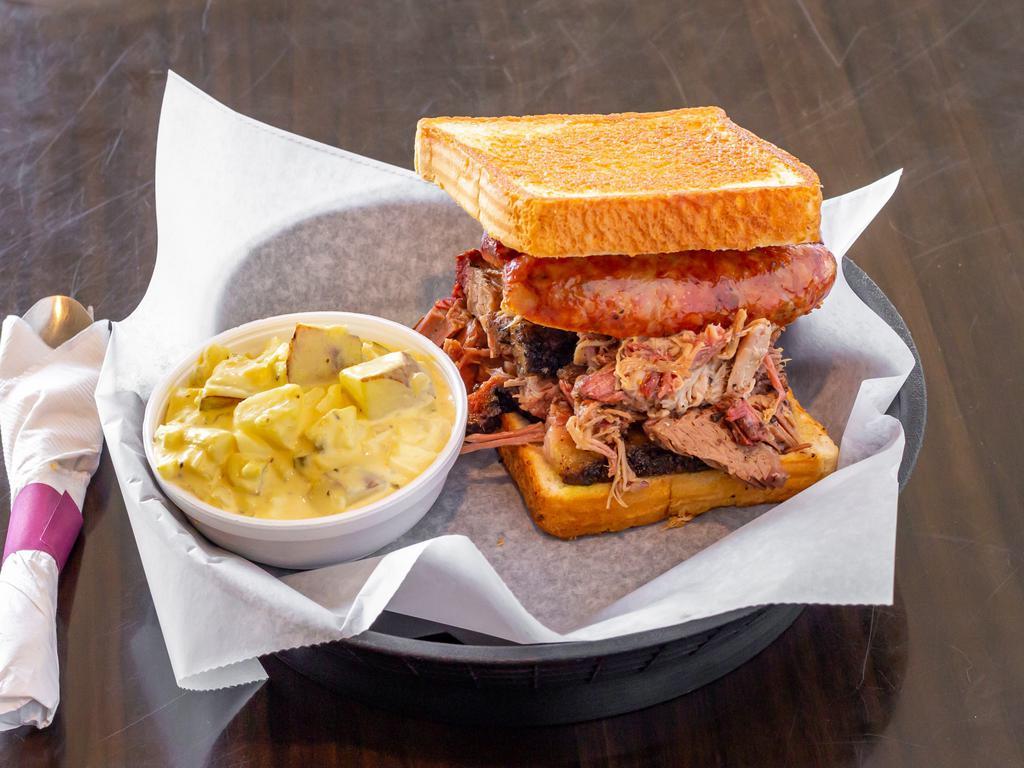 Pitmaster Deluxe Sandwich Combo · Our largest sandwich stacked high with smoked brisket, pulled pork and jalapeno cheddar sausage between Texas toast.  Comes with a side, drink and choice of sauce on side.