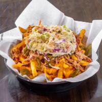 Loaded Fries · Crispy fries, nacho cheese sauce with pulled pork, jalapenos, and coleslaw.