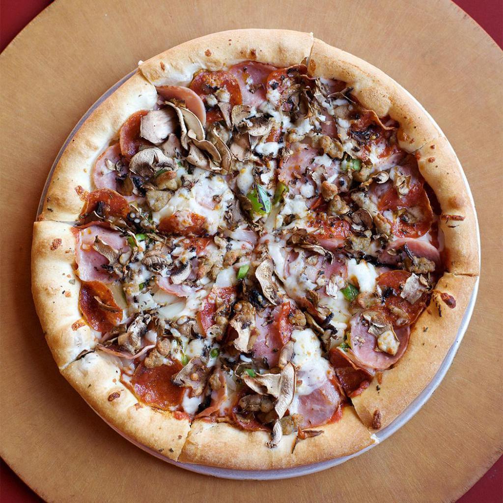 The Works Pizza · Mozzarella, onion, green pepper, smoked ham, pepperoni, Italian sausage, mushroom, smoked provolone and oregano.