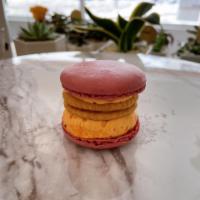 Berry Cheddar Macarons · Red-velvet shell with cheddar cheese cream.