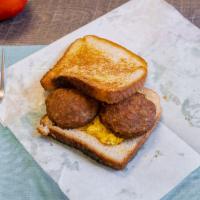 Sausage Sandwich · Sandiwch made with minced seasoned meat cooked inside of a casing. 